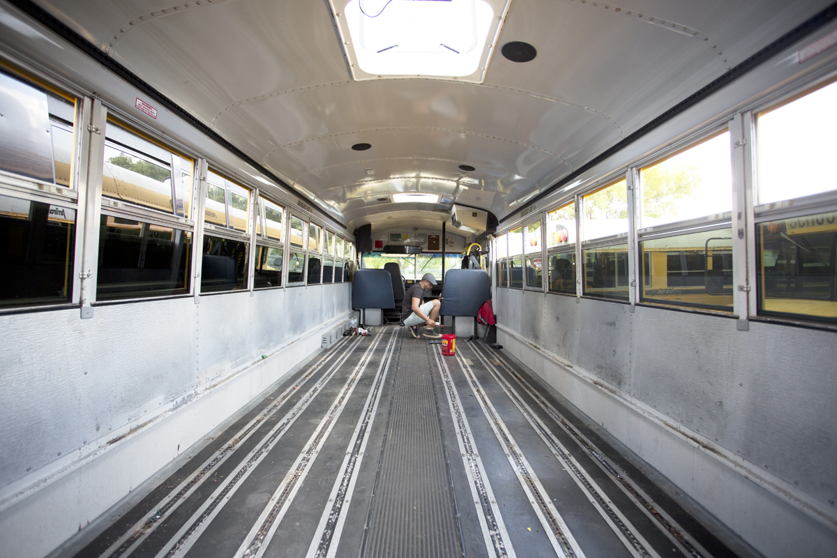School bus with tracking floor