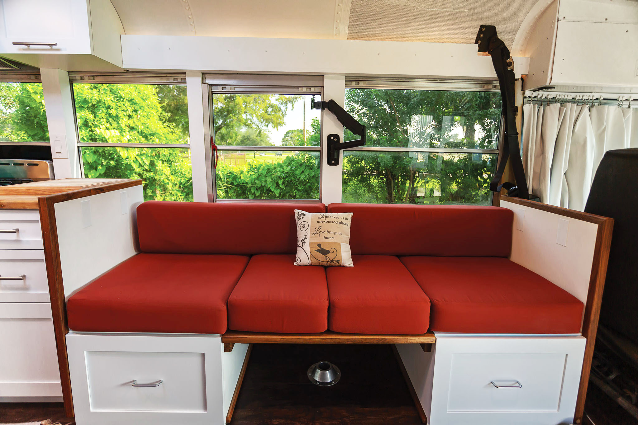 Skoolie school bus conversion dinette couch sofa
